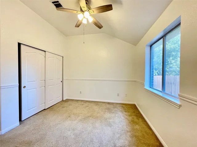 a white toilet sitting next to a shower curtain
