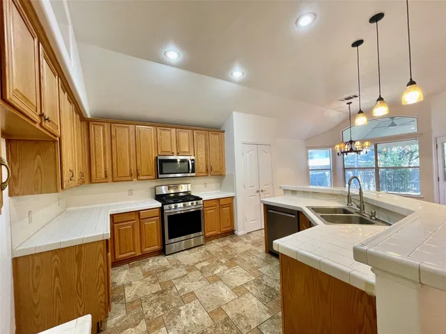 an empty room with a ceiling fan and a window
