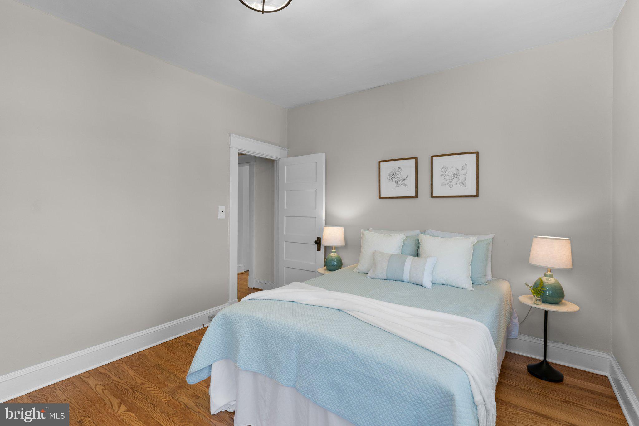 45 Edmondson Ridge Road Baltimore, MD 21228 - Photo 13 of 44 a bedroom with a bed and a lamp