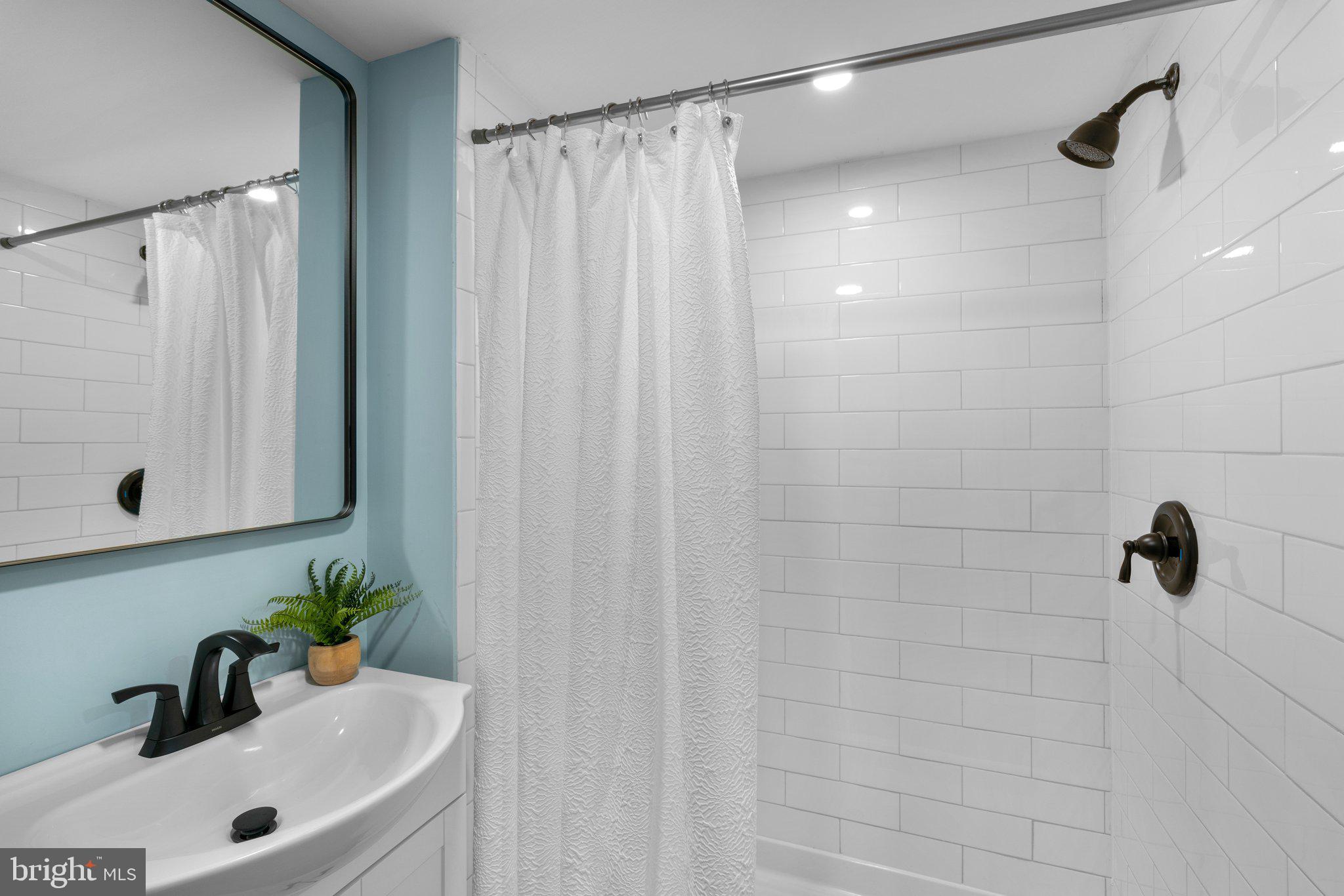45 Edmondson Ridge Road Baltimore, MD 21228 - Photo 20 of 44 a bathroom with a sink and a shower