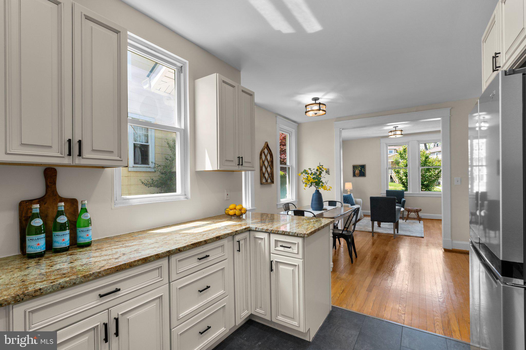 45 Edmondson Ridge Road Baltimore, MD 21228 - Photo 9 of 44 a spacious kitchen with stainless steel appliances granite countertop a lot of counter space and wooden floors