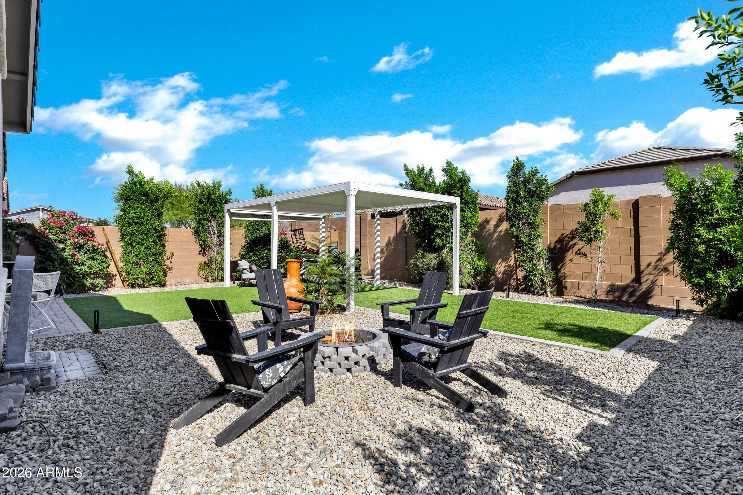 12243 East Sereno Road Gold Canyon, AZ 85118 - Photo 37 of 37 a view of a house with backyard sitting area and garden