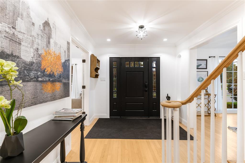 5947 Lupton Drive Dallas, TX 75225 - Photo 31 of 39 Entrance foyer with light wood finished floors, crown molding, recessed lighting, and stairs
