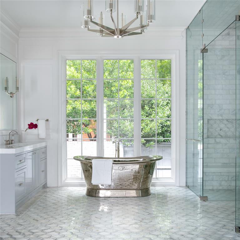 5947 Lupton Drive Dallas, TX 75225 - Photo 9 of 39 Full bathroom featuring ornamental molding, vanity, a soaking tub, a shower stall, and a chandelier