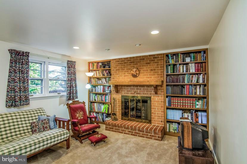 7904 Clearfield Road Frederick, MD 21702 - Photo 13 of 30 Family Room w/wood burning fireplace & bookshelves
