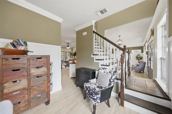 a view of room with painting and wooden floor