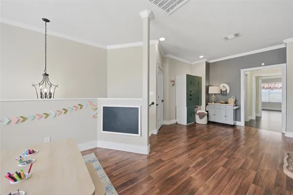 a living room with furniture and a pool table