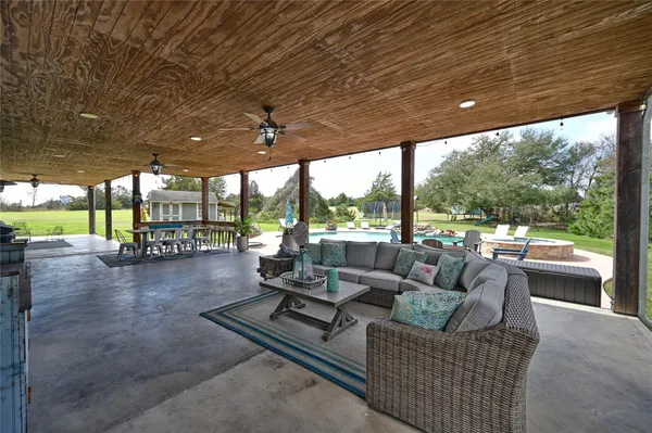 a view of pool with outdoor seating