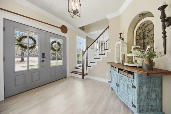 a view of an entryway with wooden floor