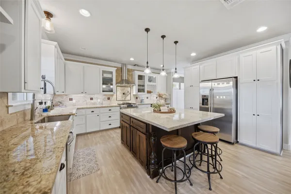 a kitchen with a sink and cabinets