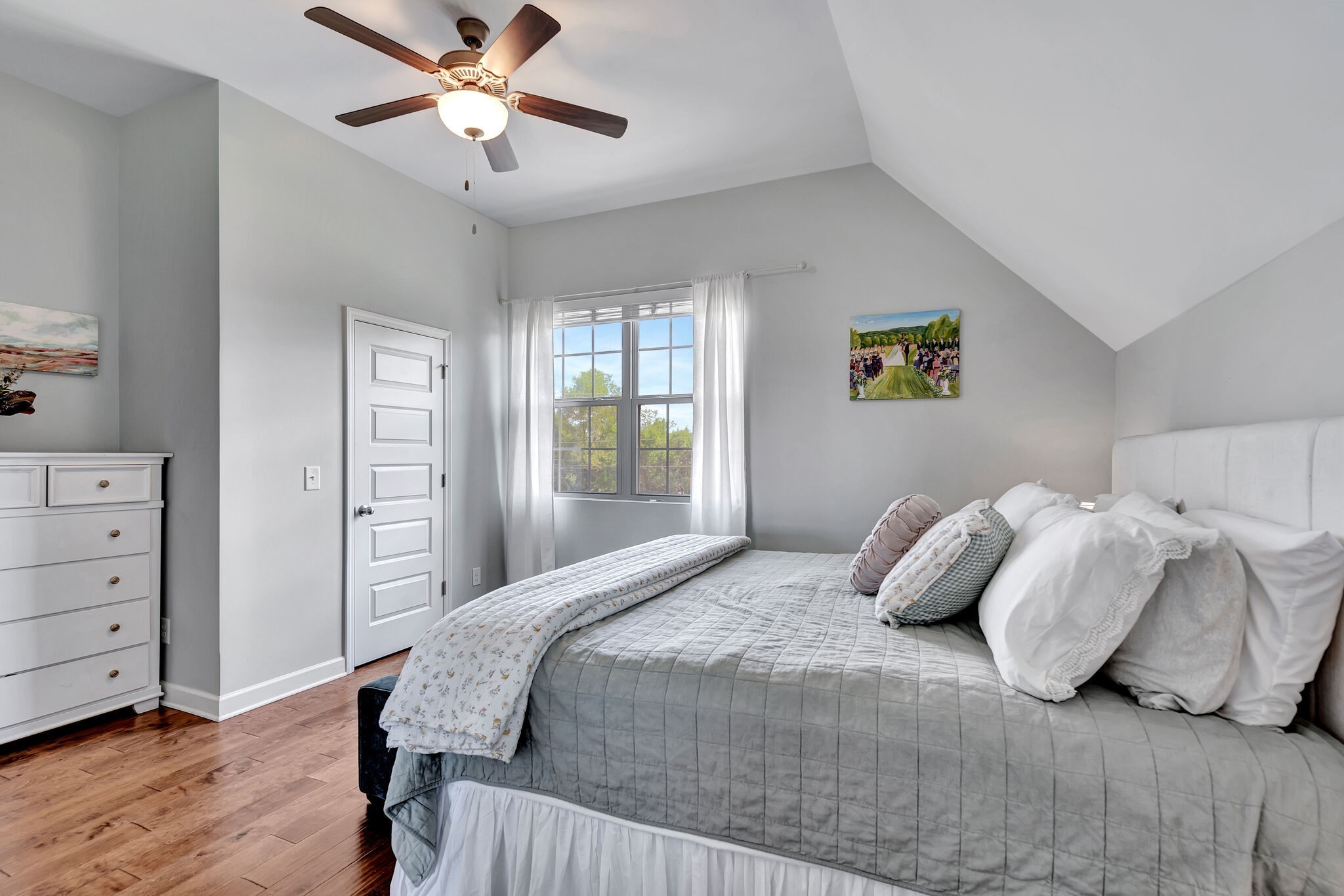 712 Bellevue Road Nashville, TN 37221 - Photo 16 of 31 a bedroom with a bed and a chandelier