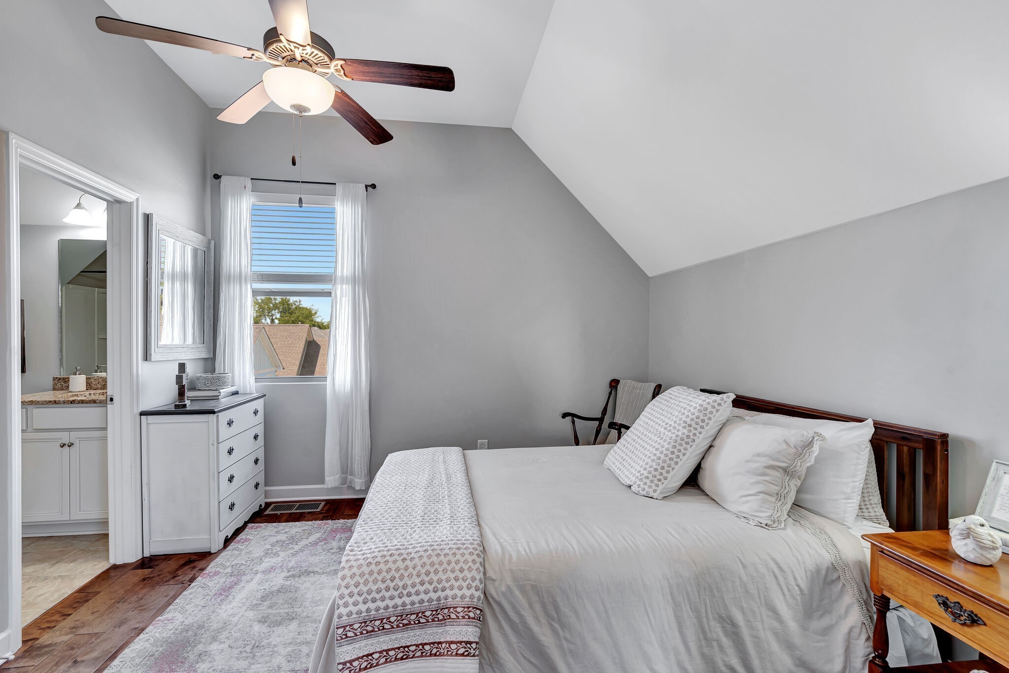 712 Bellevue Road Nashville, TN 37221 - Photo 20 of 31 a bedroom with a large bed and a chandelier