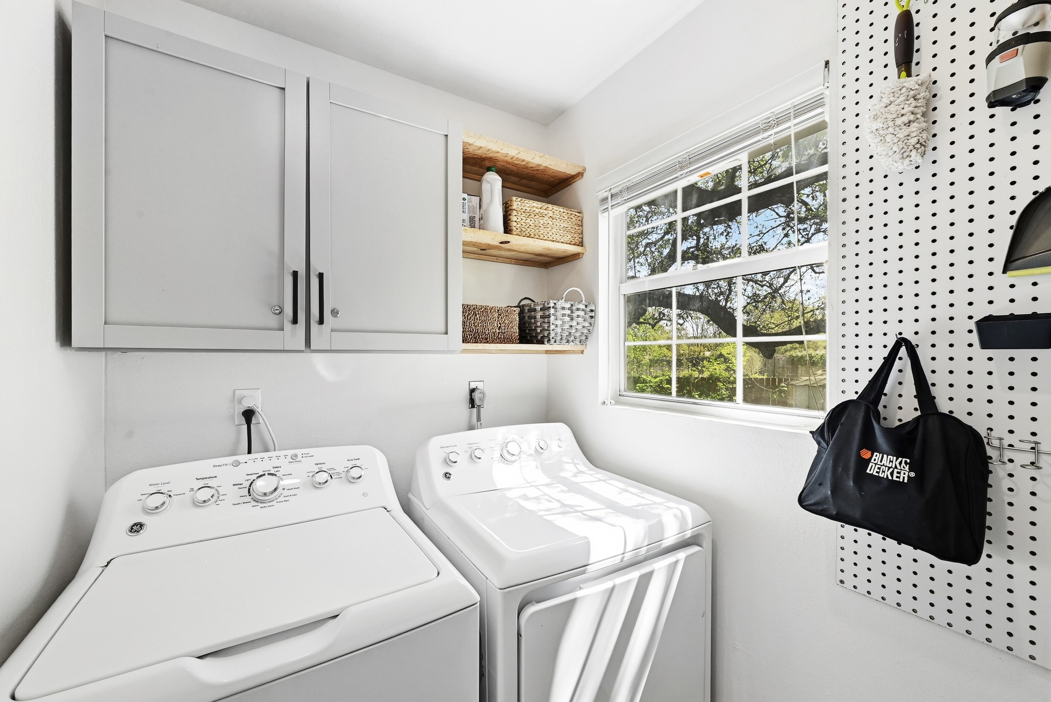 2207 Balboa Road Austin, TX 78733 - Photo 22 of 34 The laundry room is fully equipped with cabinet storage for efficiency and convenience.