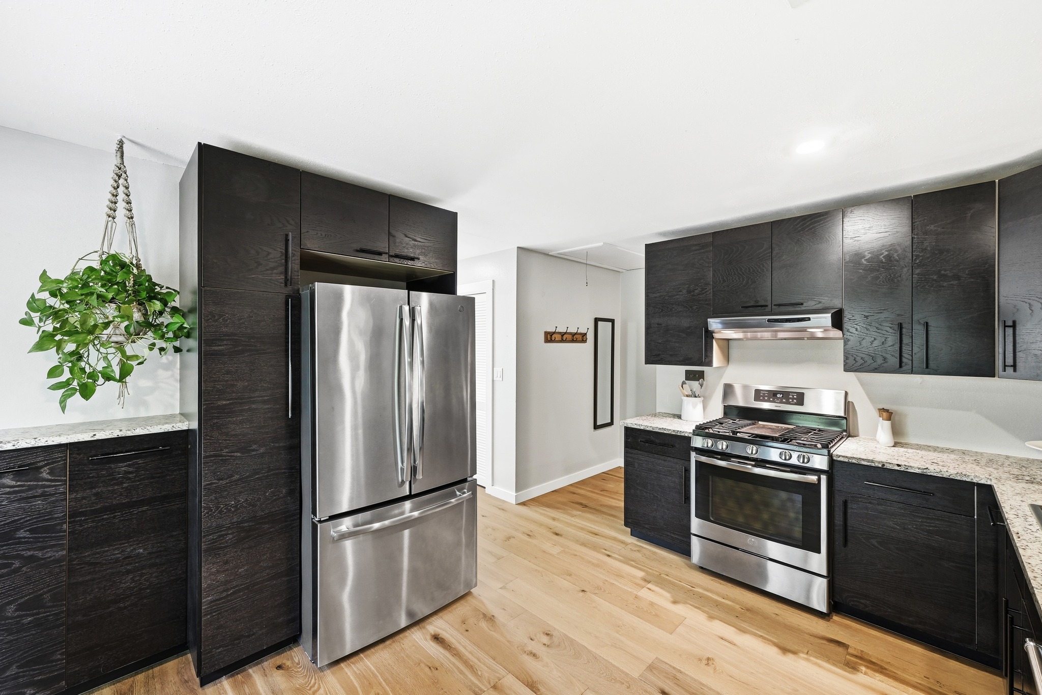 2207 Balboa Road Austin, TX 78733 - Photo 8 of 34 The kitchen is equipped with stainless steel appliances, including a gas cooktop.