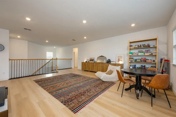 a living room with furniture and a table