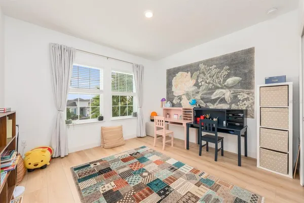 a bedroom with furniture and a window