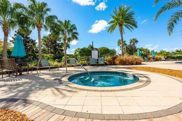 a view of a swimming pool with a patio