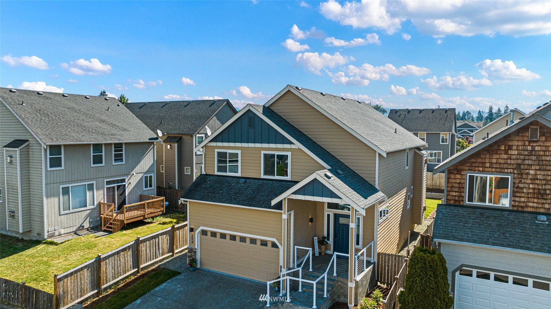 254 Whitman Place Northeast Renton, WA 98059 - Photo 2 of 32 a front view of a house with yard
