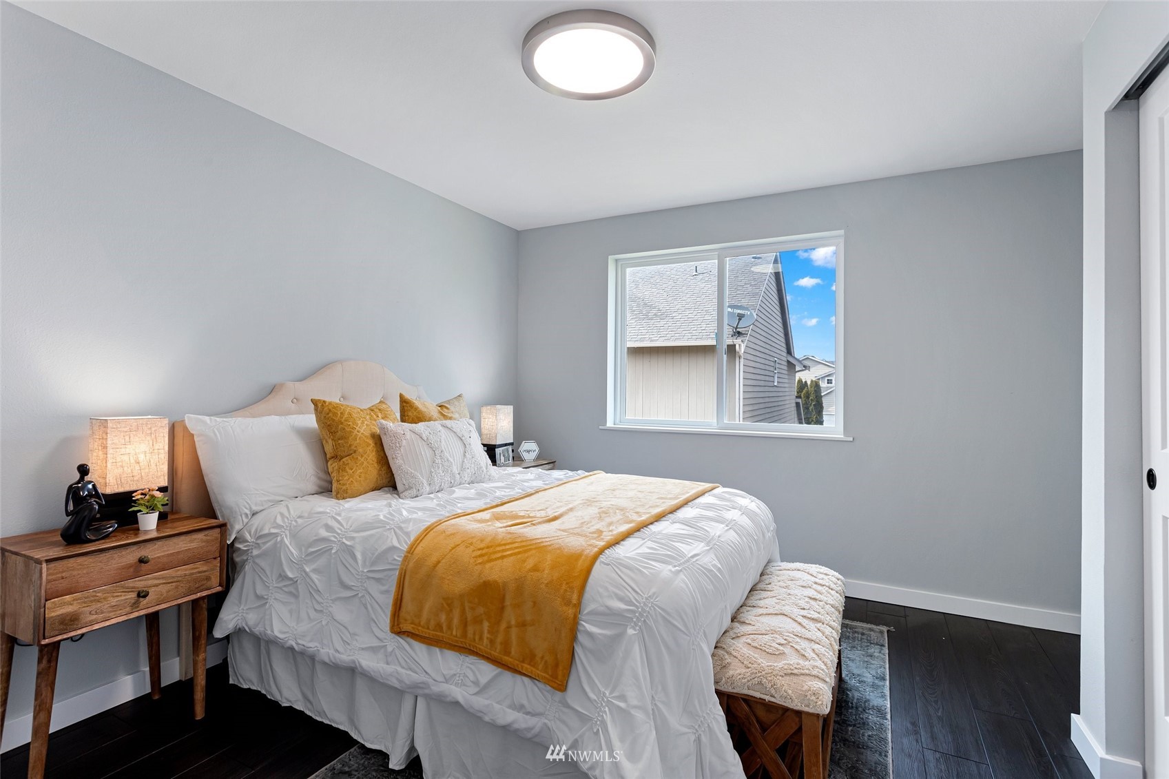 254 Whitman Place Northeast Renton, WA 98059 - Photo 21 of 32 a bedroom with a bed and wooden floor
