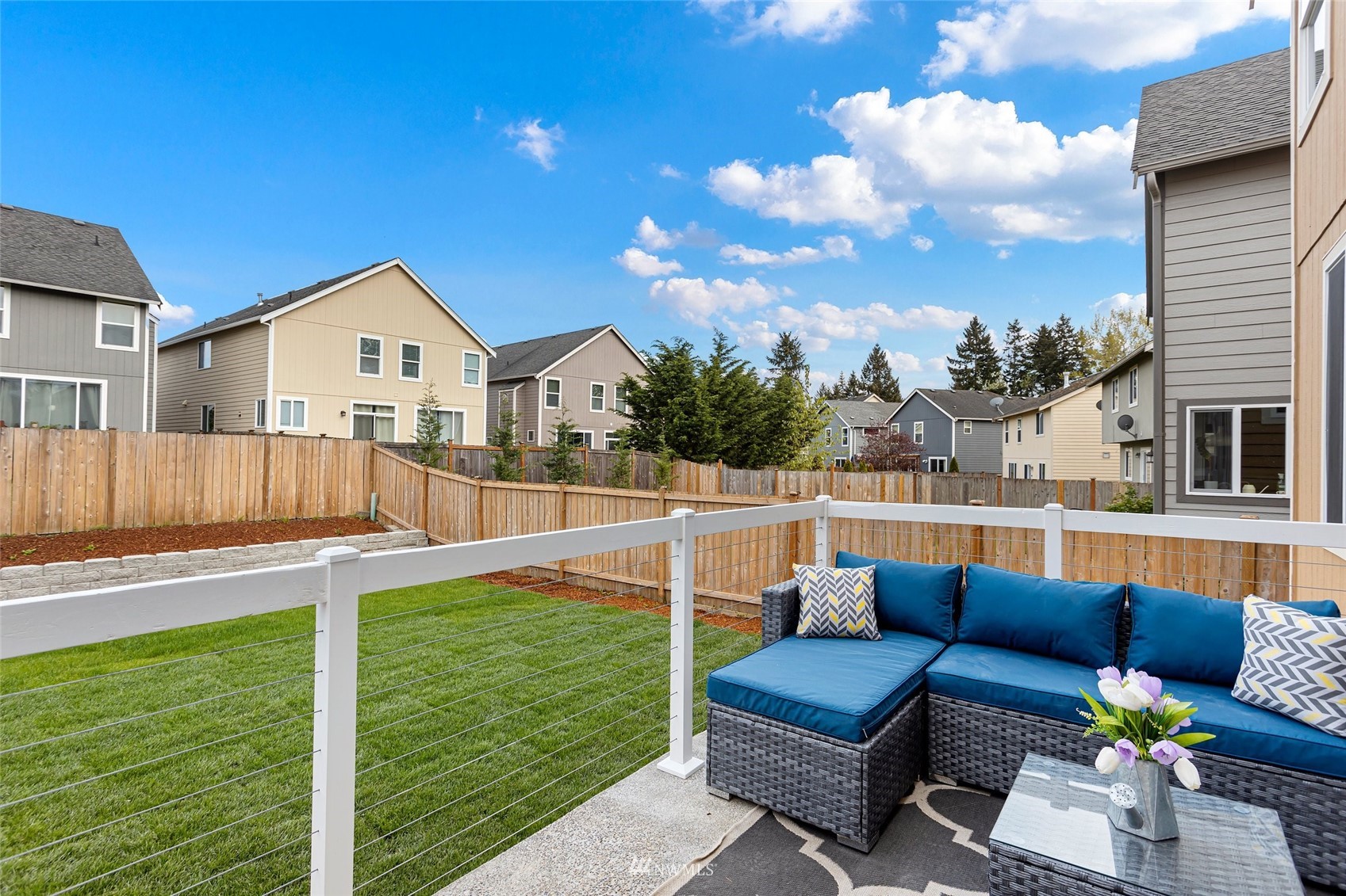 254 Whitman Place Northeast Renton, WA 98059 - Photo 29 of 32 a view of a patio with couches chairs and a yard