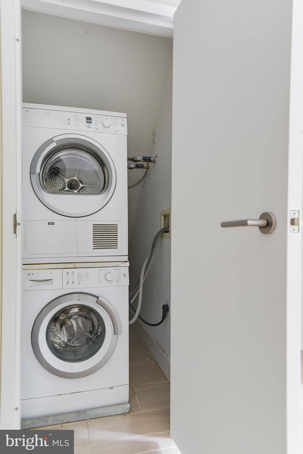 2250 11th Street Northwest, Unit 108 Washington, DC 20001 - Photo 11 of 26 a utility room with dryer and washer