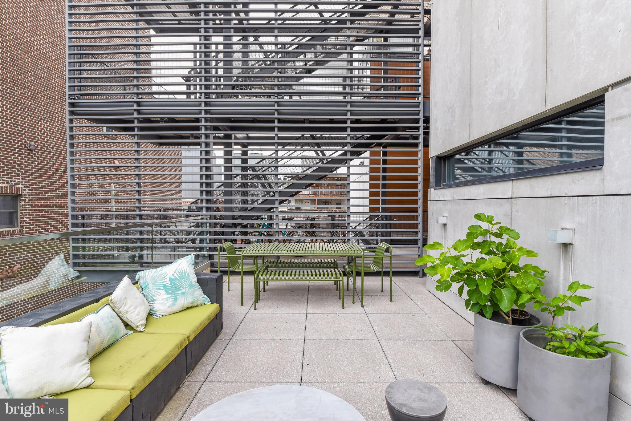 2250 11th Street Northwest, Unit 108 Washington, DC 20001 - Photo 23 of 26 a view of a chairs and table in the back