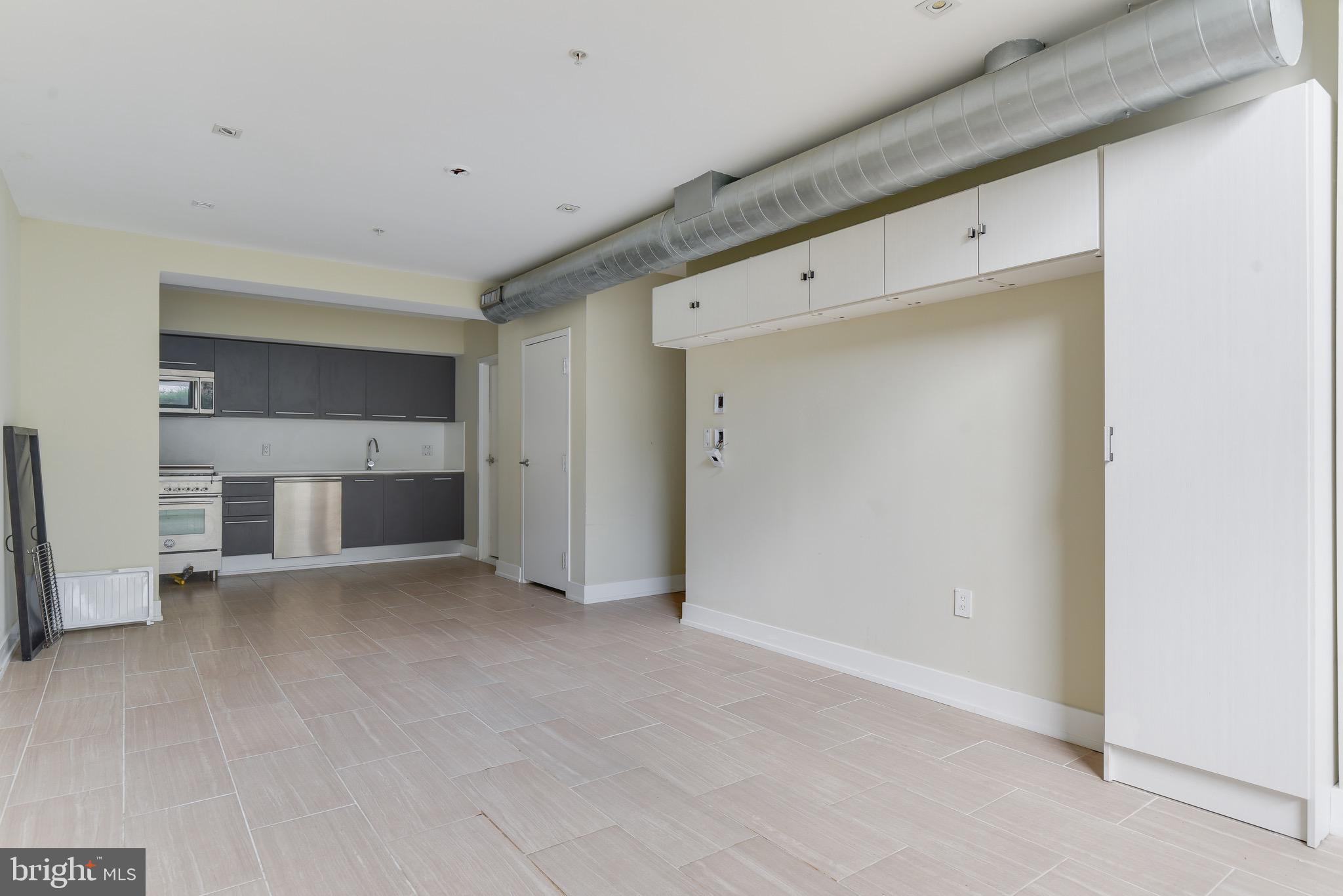 2250 11th Street Northwest, Unit 108 Washington, DC 20001 - Photo 7 of 26 a view of empty room with a fireplace