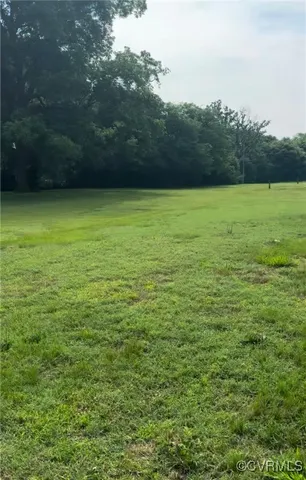 a view of a field with an outdoor space