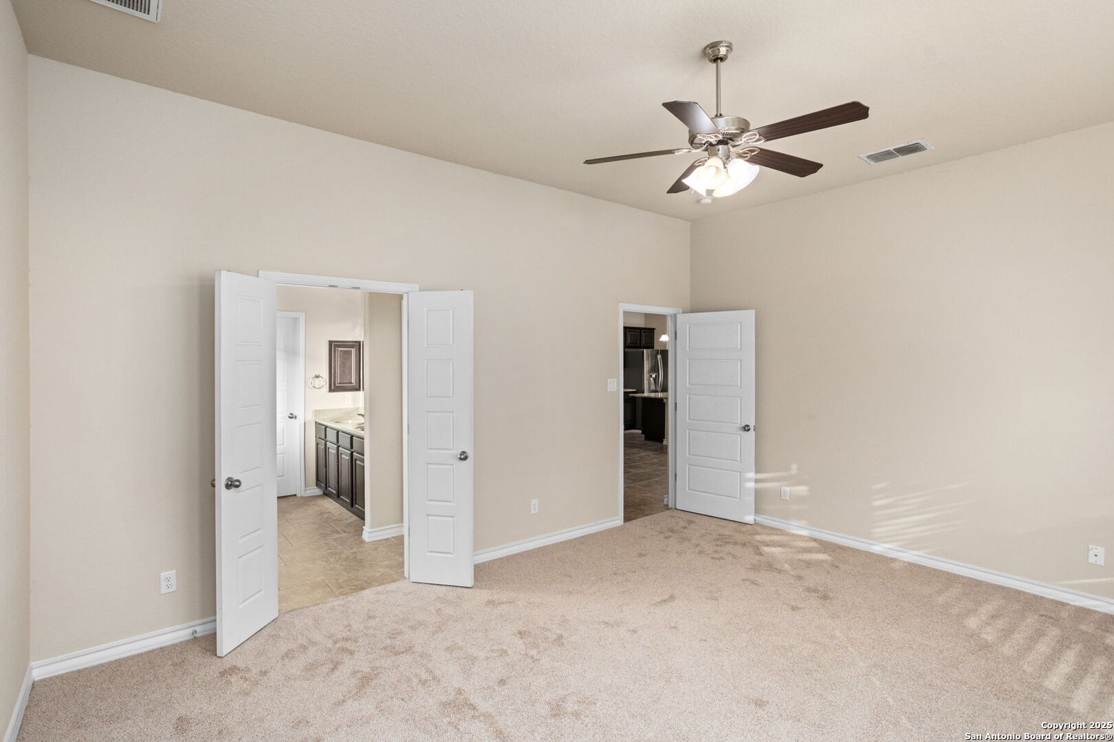 601 Saddle Villa Cibolo, TX 78108 - Photo 11 of 15 a view of a room with a ceiling fan and entryway