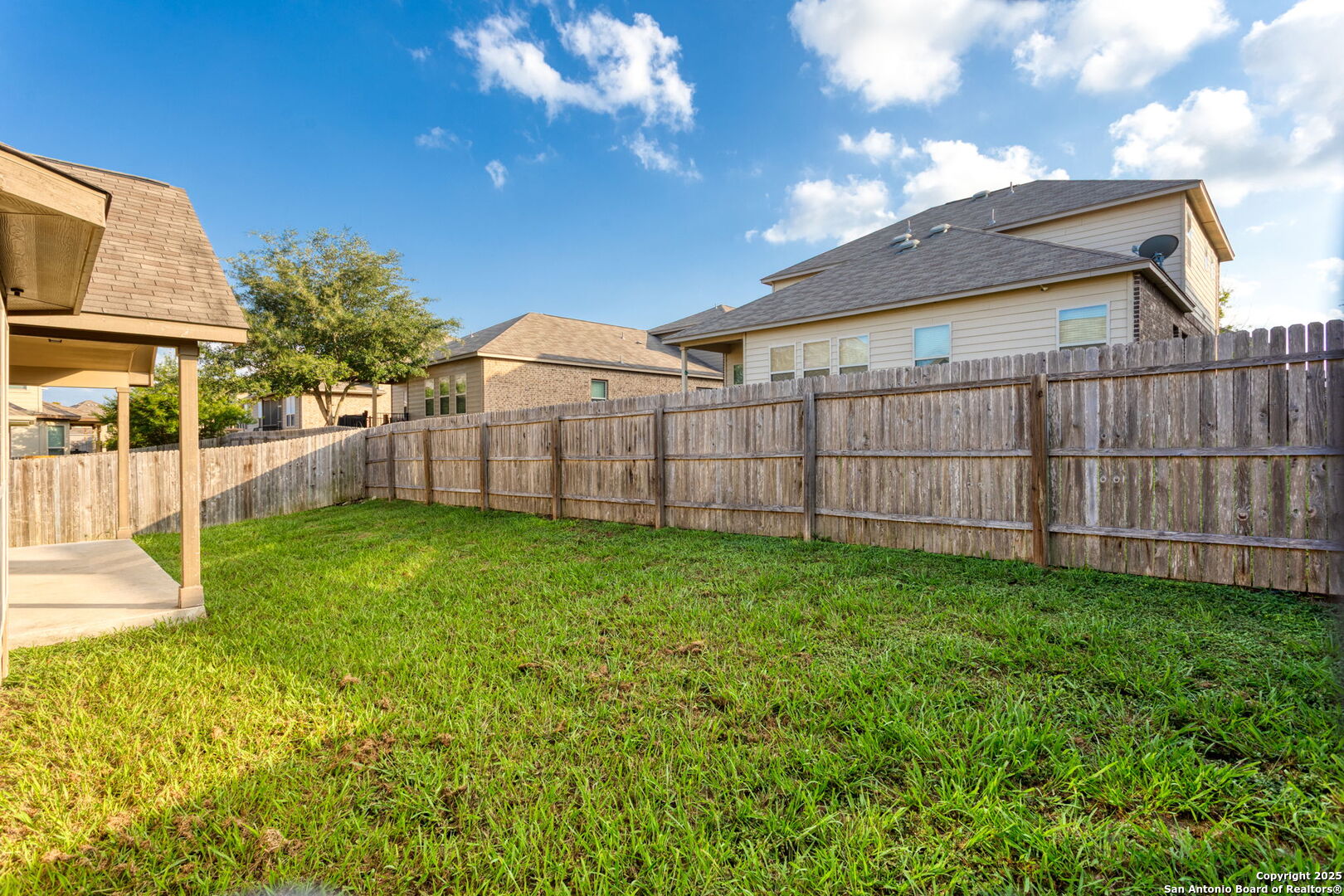 601 Saddle Villa Cibolo, TX 78108 - Photo 14 of 15 a view of a backyard with a garden and deck