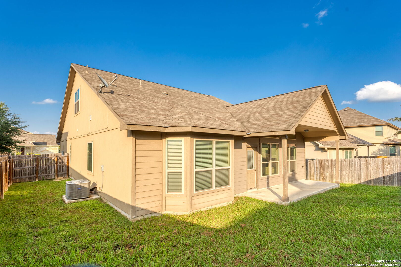 601 Saddle Villa Cibolo, TX 78108 - Photo 15 of 15 a backyard of a house with table and chairs