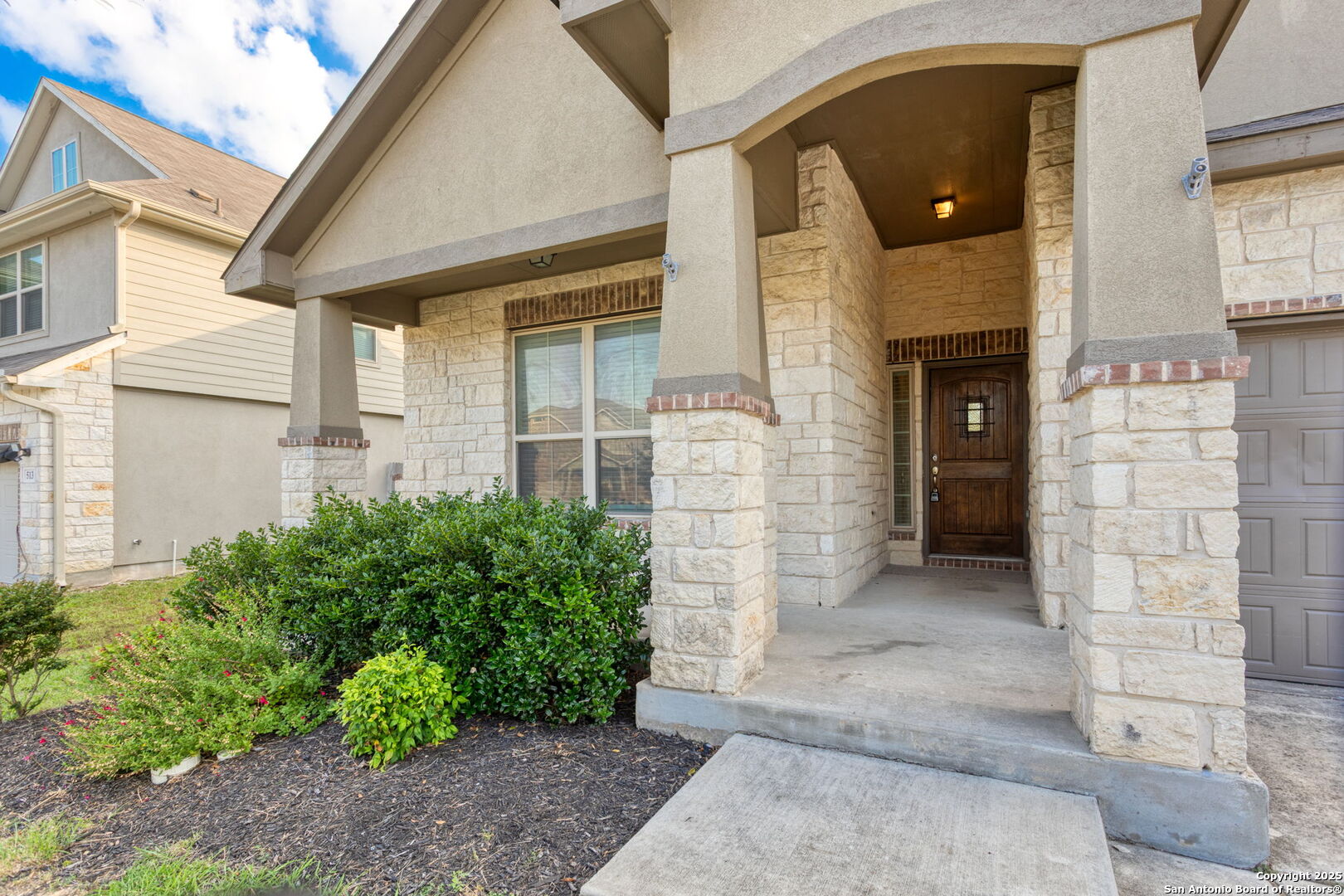 601 Saddle Villa Cibolo, TX 78108 - Photo 3 of 15 a view of a brick house with potted plants