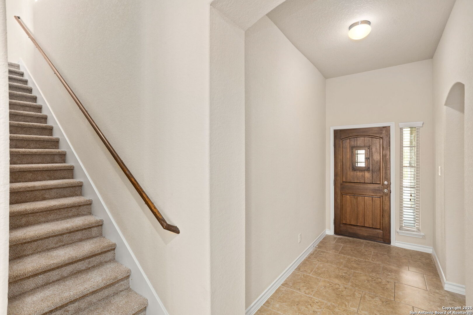601 Saddle Villa Cibolo, TX 78108 - Photo 4 of 15 a view of staircase with wooden floor and white walls