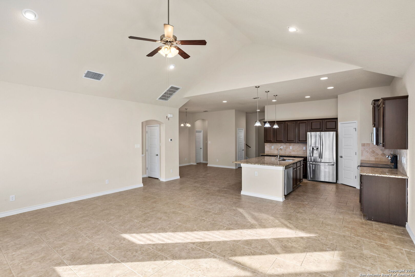 601 Saddle Villa Cibolo, TX 78108 - Photo 7 of 15 a view of kitchen with stainless steel appliances kitchen island a sink a refrigerator and chairs