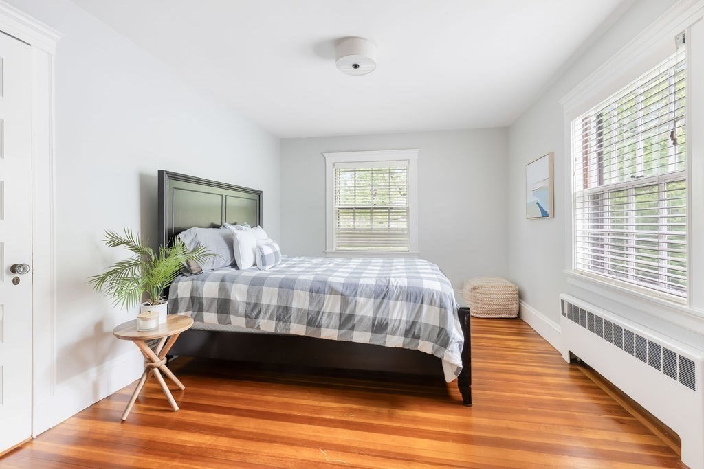 311 Clark Road Brookline, MA 02445 - Photo 11 of 26 a bedroom with a bed and a chair