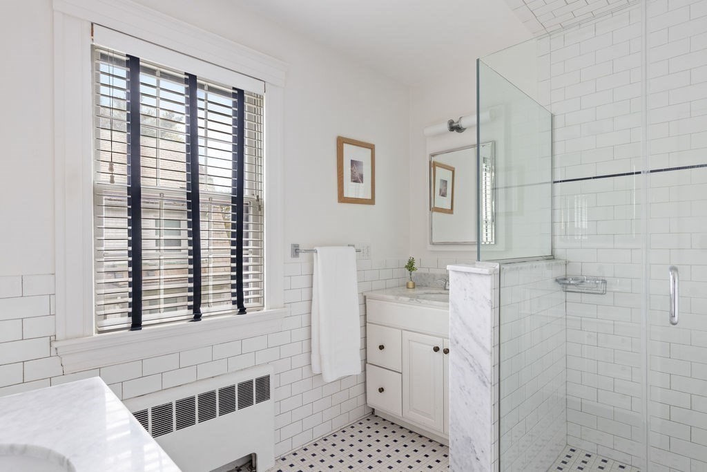 311 Clark Road Brookline, MA 02445 - Photo 14 of 26 a bathroom with a granite countertop sink a toilet and shower