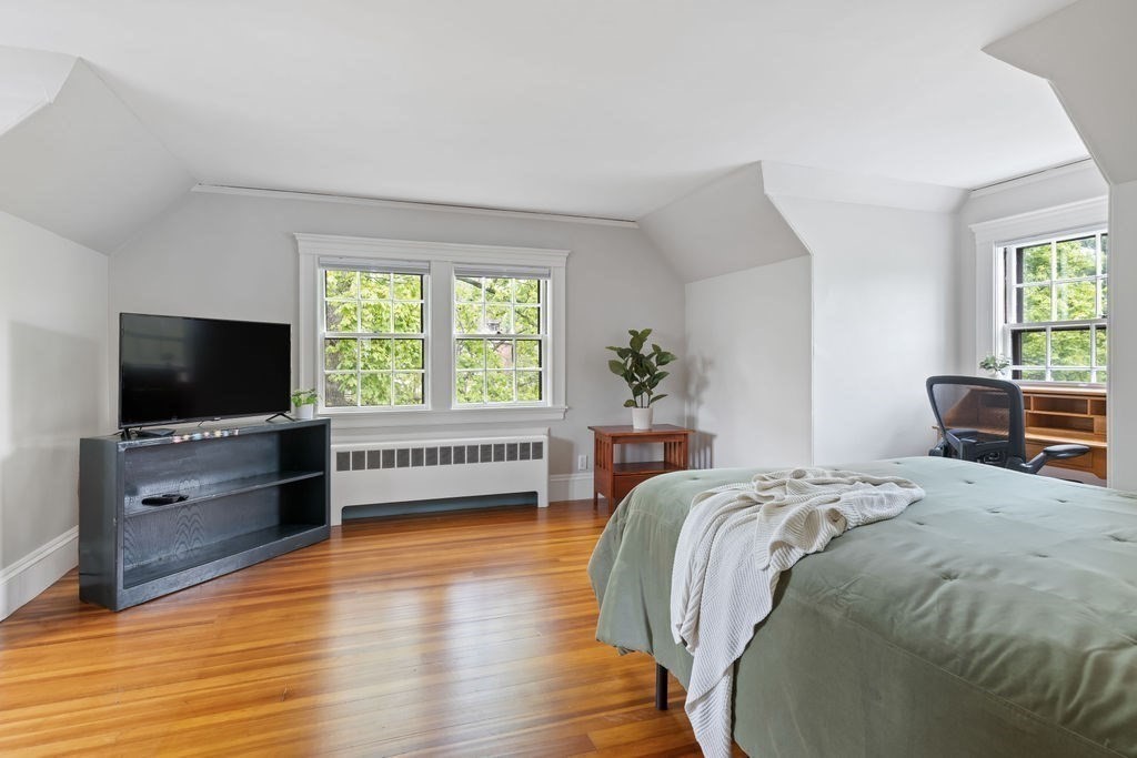 311 Clark Road Brookline, MA 02445 - Photo 17 of 26 a bed room with a bed and a television