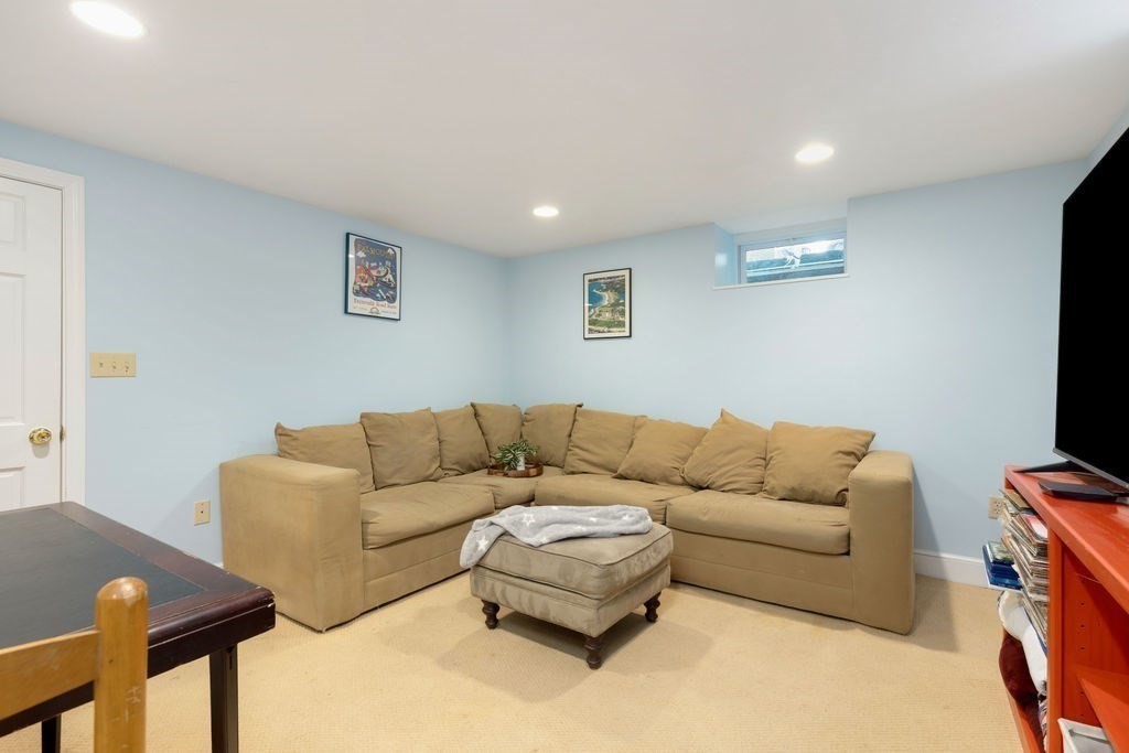 311 Clark Road Brookline, MA 02445 - Photo 21 of 26 a living room with furniture and a flat screen tv