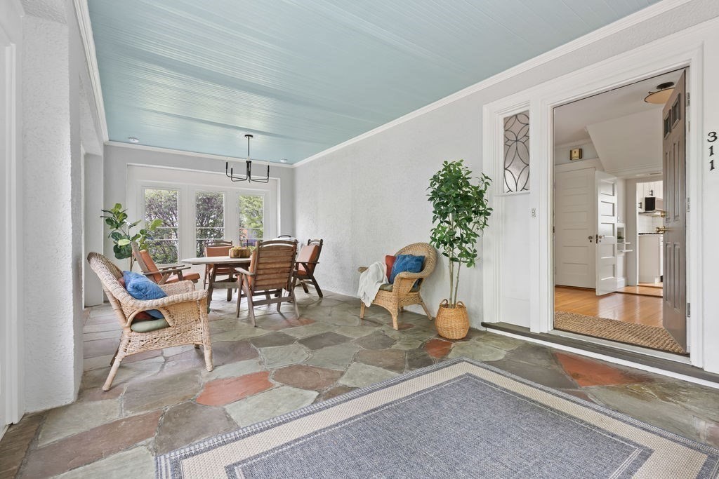 311 Clark Road Brookline, MA 02445 - Photo 22 of 26 a view of a dining room with furniture and a potted plant