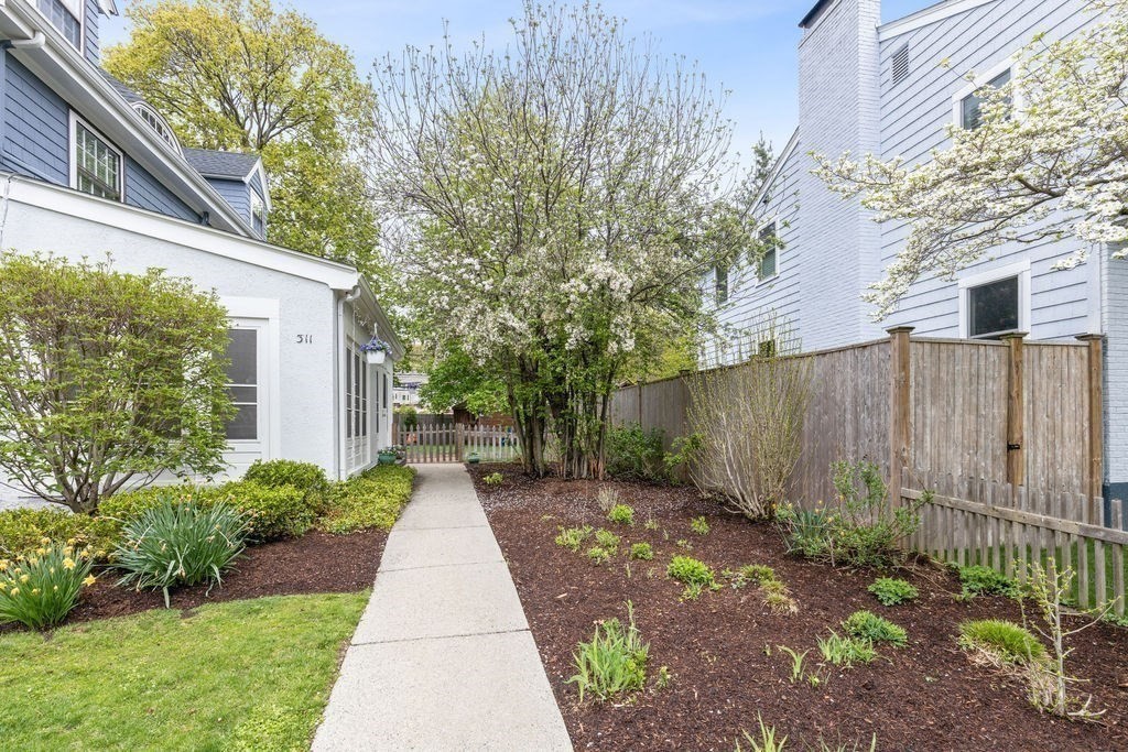 311 Clark Road Brookline, MA 02445 - Photo 23 of 26 a front view of a house with garden