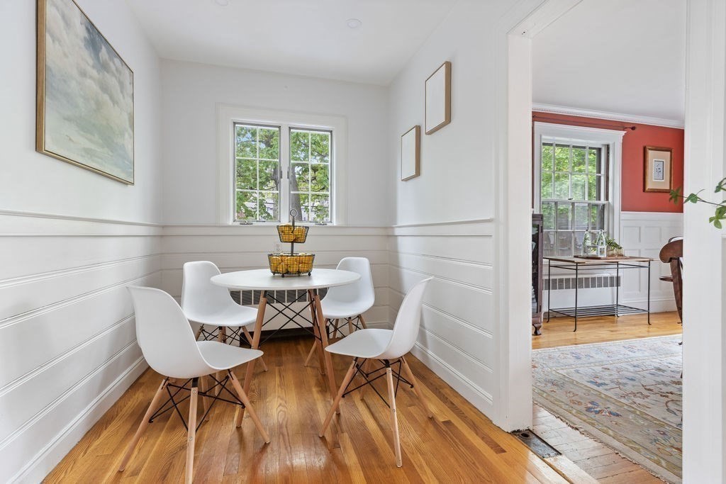 311 Clark Road Brookline, MA 02445 - Photo 7 of 26 a view of a dining room with furniture a rug and wooden floor