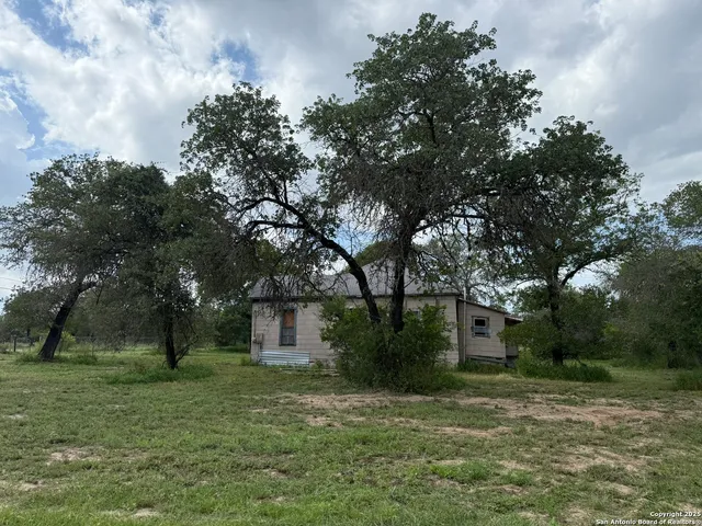 a backyard of a house with lots of green space