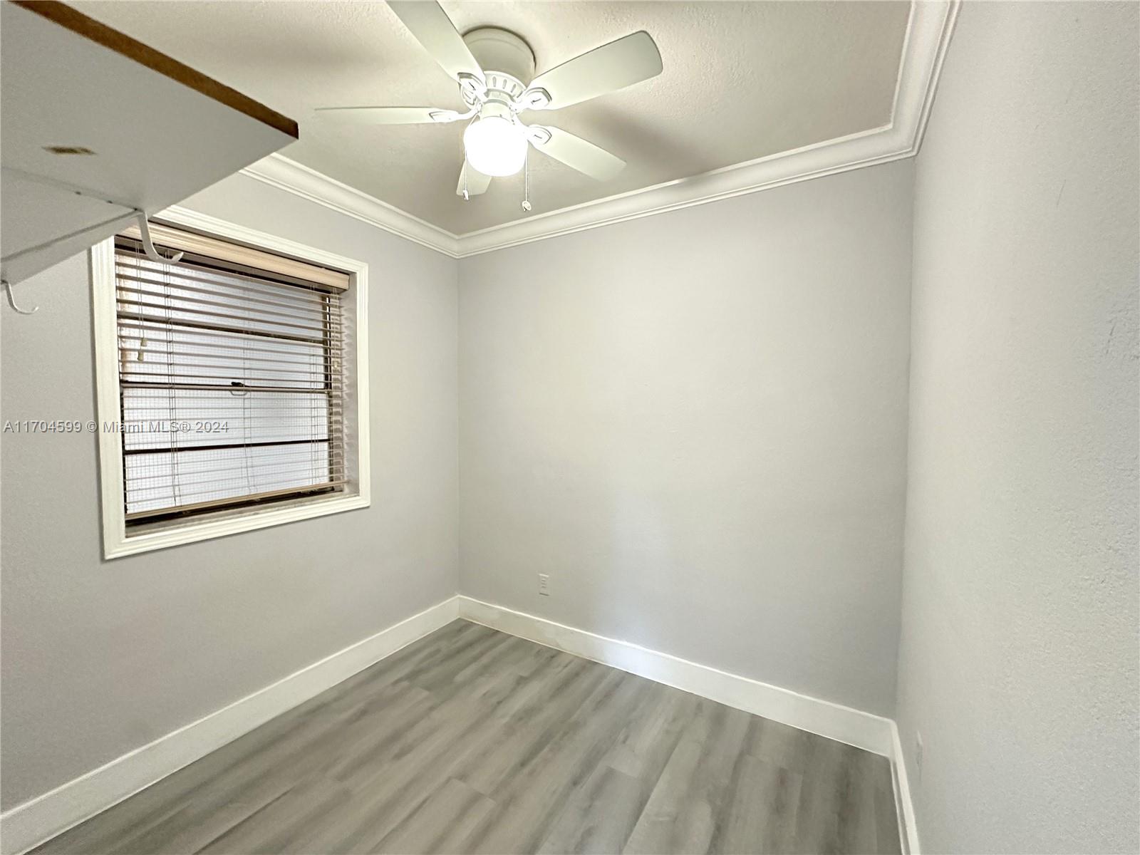 7101 Southwest 89th Court, Unit 110 Miami, FL 33173 - Photo 14 of 16 an empty room with a window
