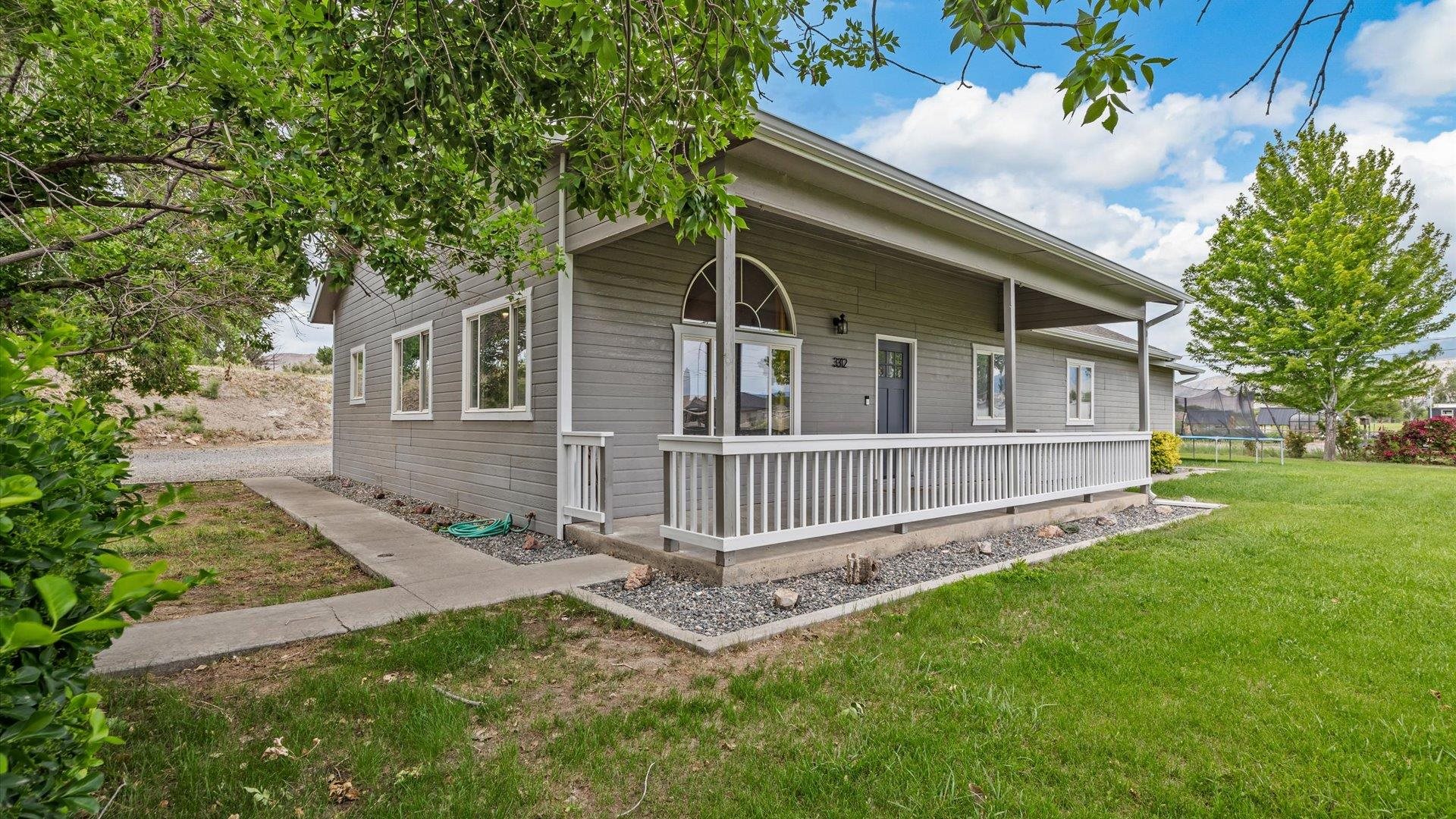 3312 East 1/4 Road Clifton, CO 81520 - Photo 11 of 42 front view of a house with a yard