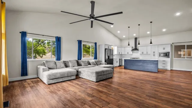 a bed room with a bed and ceiling fan