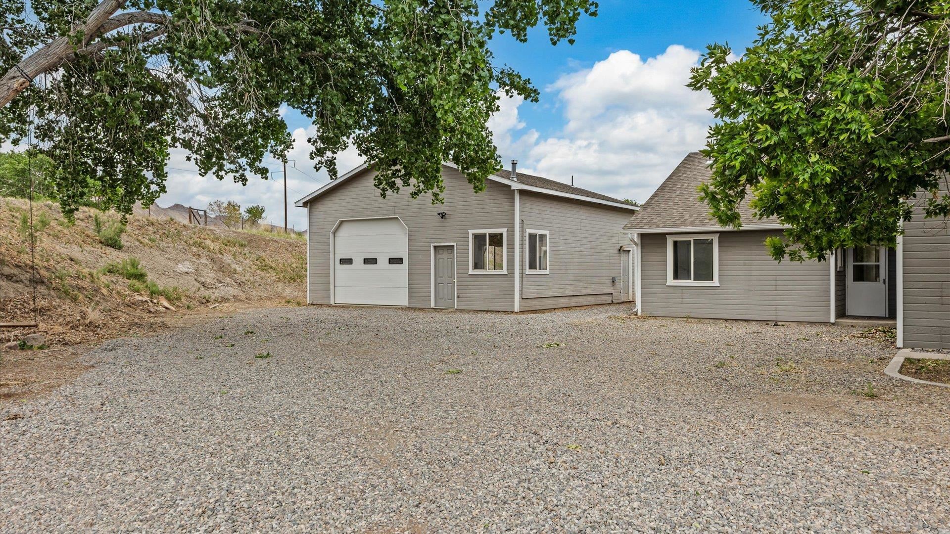 3312 East 1/4 Road Clifton, CO 81520 - Photo 2 of 42 front view of a house with a trees
