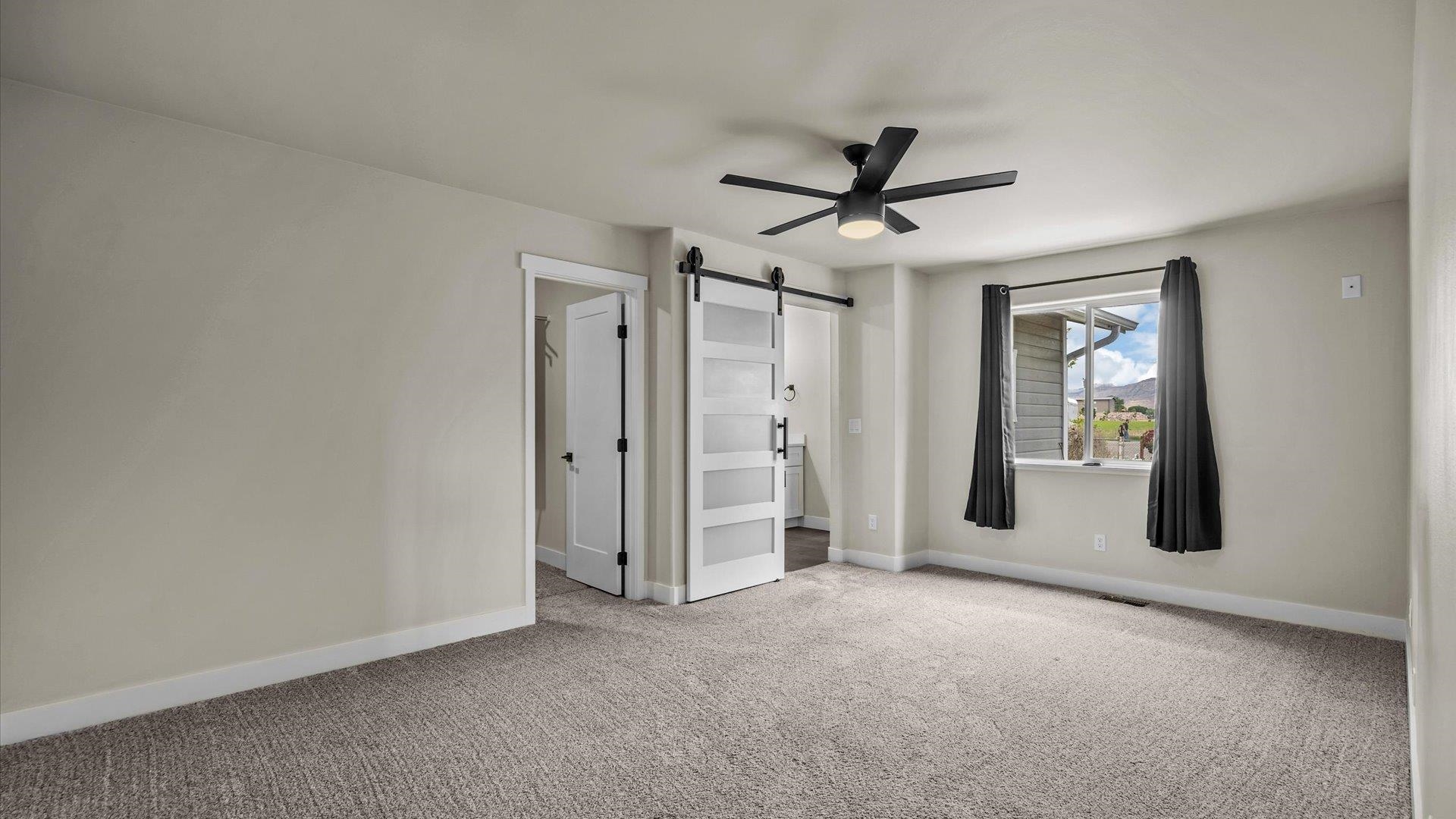 3312 East 1/4 Road Clifton, CO 81520 - Photo 21 of 42 a view of a livingroom with a ceiling fan and window