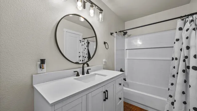 a kitchen with stainless steel appliances a stove top oven a sink and a refrigerator