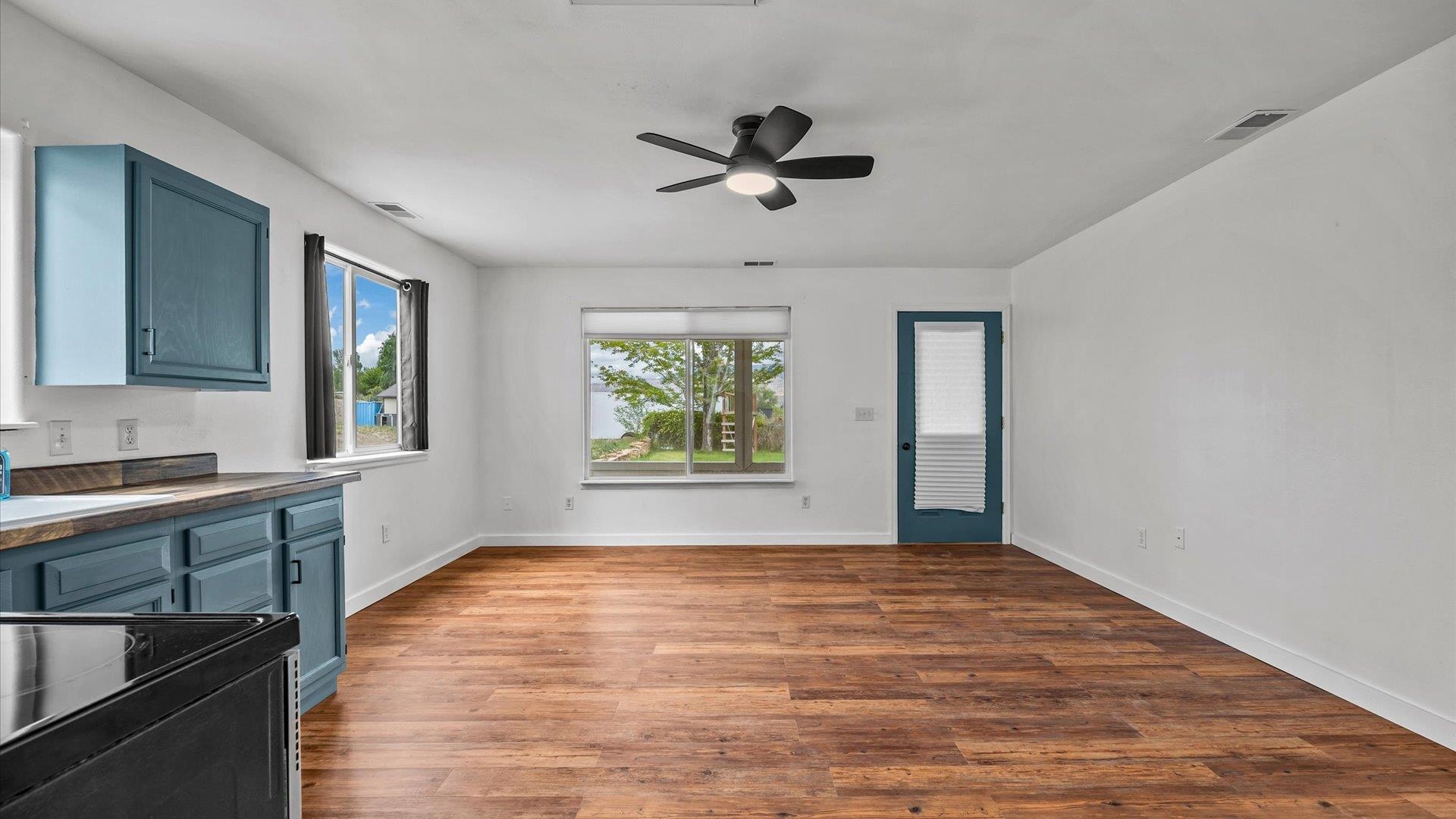 3312 East 1/4 Road Clifton, CO 81520 - Photo 32 of 42 a view of an empty room with window and wooden floor