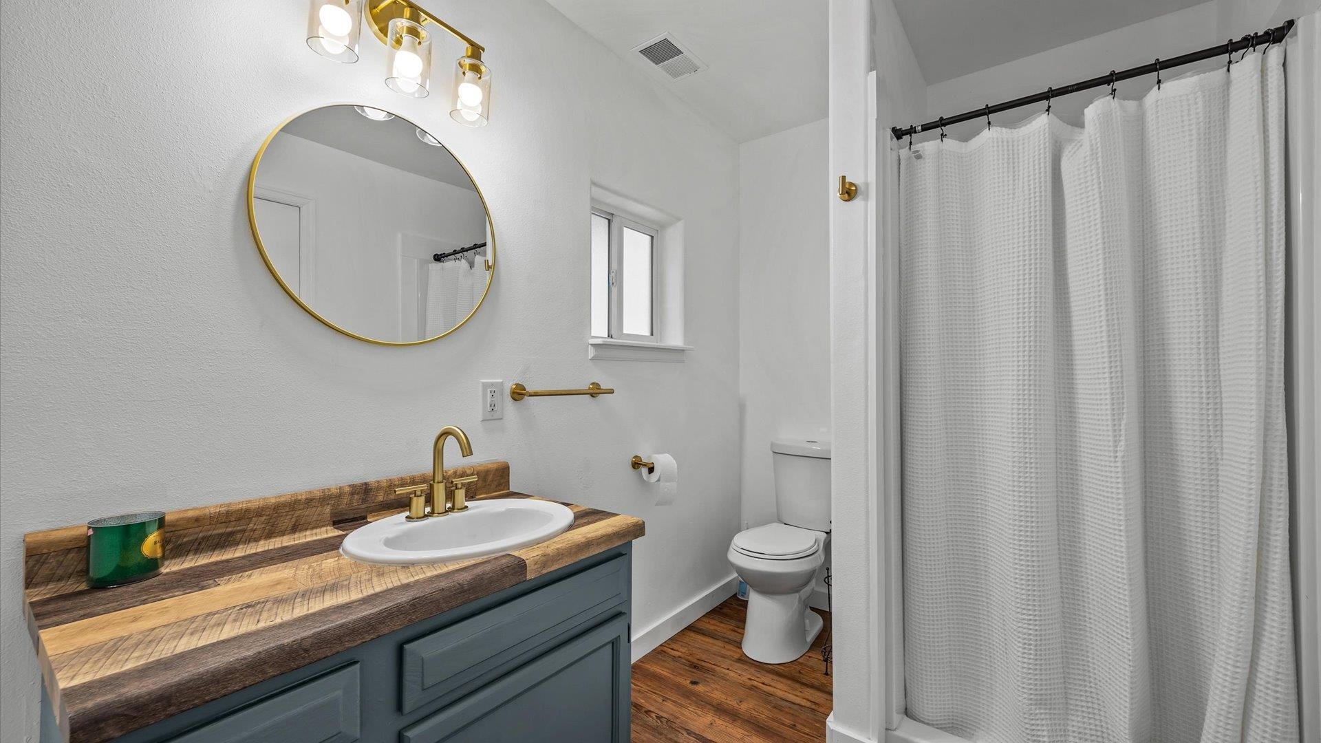3312 East 1/4 Road Clifton, CO 81520 - Photo 34 of 42 a bathroom with a sink a toilet and a mirror